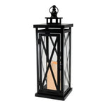 Black Crisscross Metal Lantern with a Battery Candle inside, perfect for cozy home decor or gifts, blending modern design with warm ambient lighting from Knotty and Board. 1
