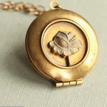 Tudor Rose Locket Necklace, 18 in. featuring a vintage-style gold-tone round locket with a raised rose design, perfect jewelry gift from Knotty and Board for adding charm to any outfit. 1