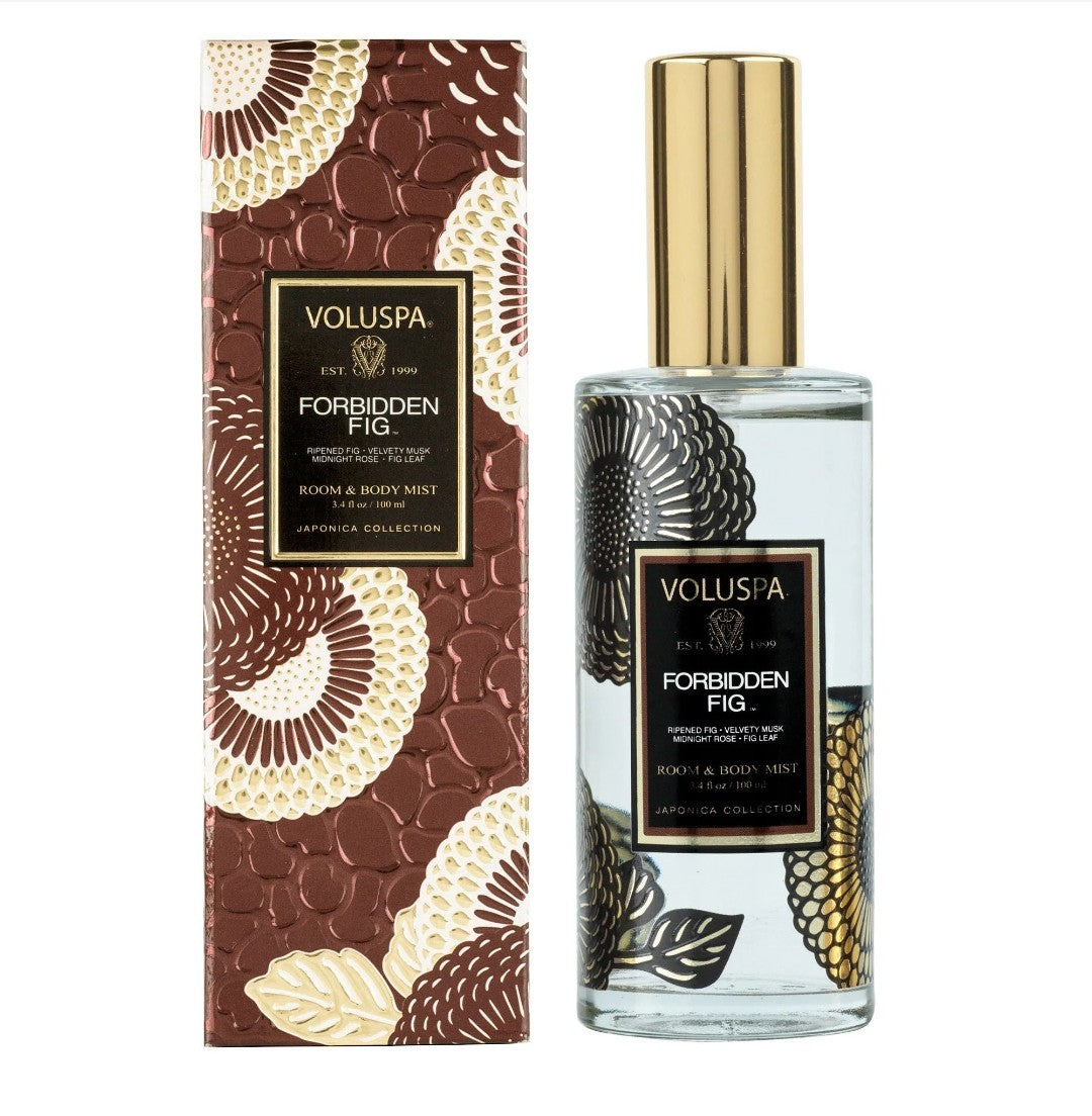 Voluspa Forbidden Fig Room & Body Spray, 3.4oz, displayed with decorative packaging featuring floral patterns, perfect for adding scent and style to any room or body, available at Knotty and Board, where every room needs a little Knotty and Board.