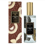 Voluspa Forbidden Fig Room & Body Spray, 3.4oz, displayed with decorative packaging featuring floral patterns, perfect for adding scent and style to any room or body, available at Knotty and Board, where every room needs a little Knotty and Board. 1