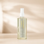 Clear spray bottle of Rockaway White Birch Room Spray with a white pump, set against a soft beige background, perfect for adding fresh decor ambiance and gifts. 1