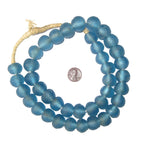 Blue textured round beads strung together with a penny for scale, showcasing Recycled Glass Beads 18 mm Assorted Colors, ideal for jewelry and decor gifts from Knotty and Board.