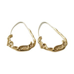 A pair of Lava Water Hoop Earrings, Gold with a unique textured design, perfect for adding elegant style to any jewelry collection from Knotty and Board. 1