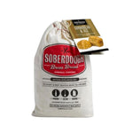 Cloth bag of Soberdough Brew Bread, Cornbread and Ale artisan beer bread mix with rustic packaging, perfect for kitchen gifts and entertaining from Knotty and Board. 1