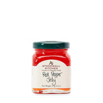 Stonewall Kitchen Red Pepper Jelly, 4 oz jar with vibrant red jelly, perfect for kitchen gifts and entertaining, featured by Knotty and Board with curated decor and gifts. 1