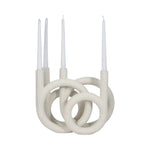 Twisted Ring 4-Taper Candle Holder, White, 12 in. with a modern sculptural design featuring intertwined rings holding four white taper candles, perfect decor for kitchen or dining by Knotty and Board. 1
