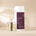 Rockaway Folklore Fig Reed Diffuser with a clear glass bottle and natural reeds, featuring fig, brown sugar, and amber scents, perfect for decor and gifts from Knotty and Board. 1