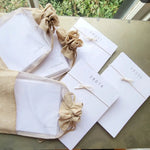 Note Card Set Pack of 10 - Huntersville featuring elegant white cards tied with natural twine, packaged in rustic burlap bags, perfect for gifts and stylish decor from Knotty and Board. 2