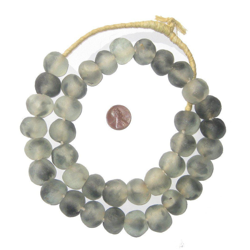Recycled Glass Beads 18 mm Assorted Colors strung on natural twine with a penny for scale, showcasing rustic decor ideal for jewelry or home accents from Knotty and Board.