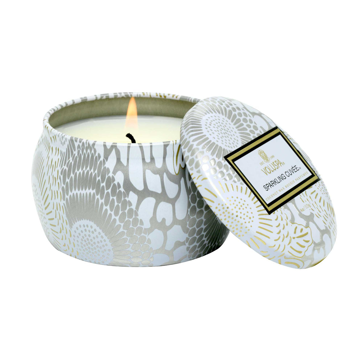 Voluspa Sparkling Cuvee Mini Tin Candle, 4 oz lit with decorative silver and gold floral pattern tin, perfect gift or decor for kitchen and entertaining, available at Knotty and Board.