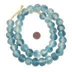 Recycled Glass Beads 18 mm Assorted Colors in shades of blue strung together with a penny for size reference, ideal for crafting jewelry or decorative gifts from Knotty and Board.