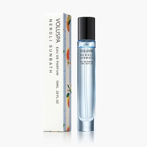 Voluspa, Eau De Parfum, 10 ml, Neroli Sunbath in a sleek glass rollerball bottle next to its white decorative box, offered by Knotty and Board, perfect gift or decor accent.