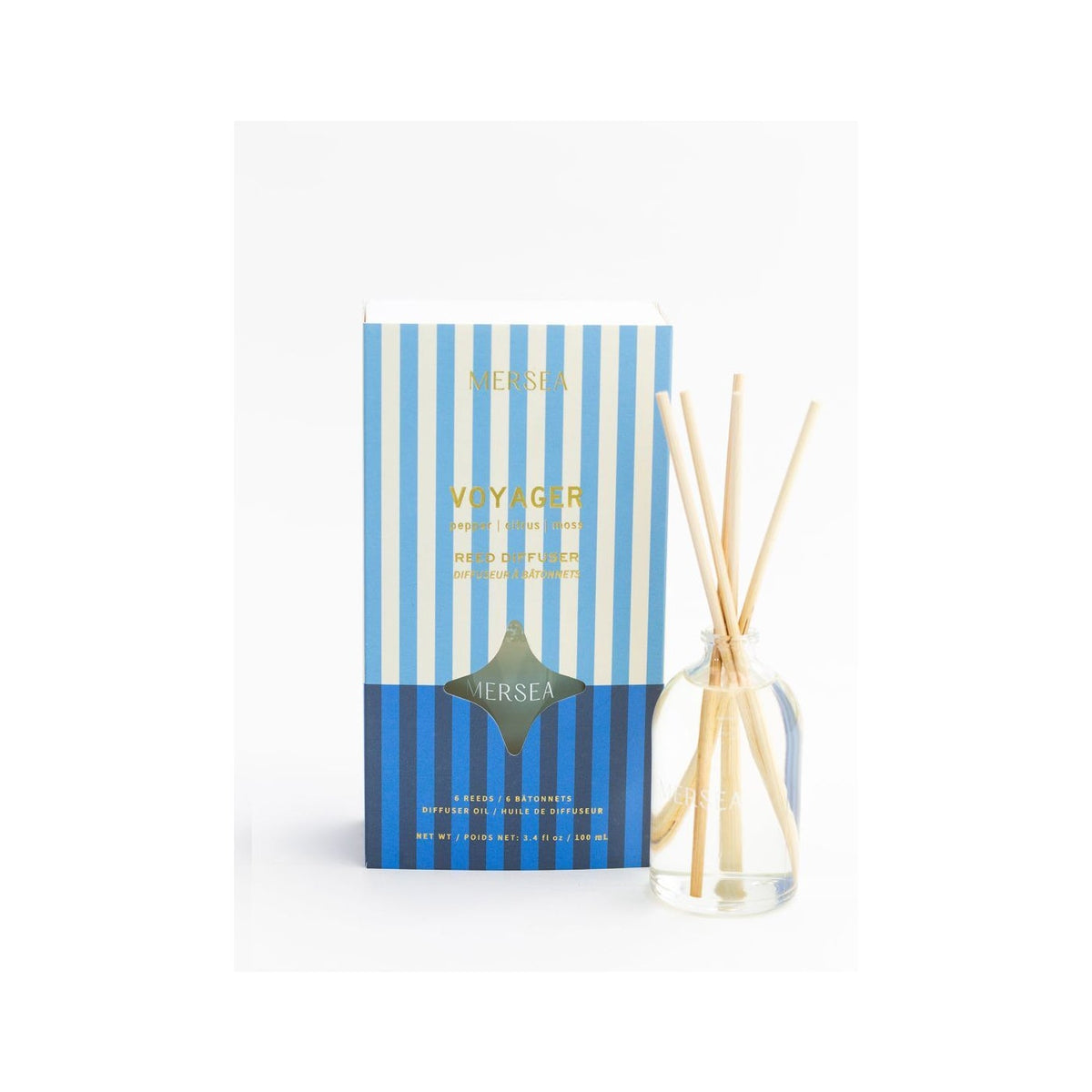 Mer-Sea Voyager, Room Diffuser, 3.4 oz with a clear glass bottle and natural reeds beside a blue and white striped box, perfect for home decor and gifts from Knotty and Board.