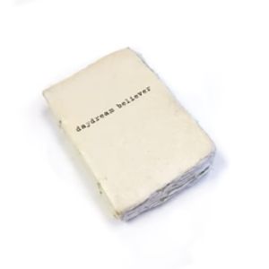 Handcrafted Deckled Edge Notebook - Daydream Believer with vintage-style cream pages, perfect for writing, journaling, or as a unique gift from Knotty and Board, ideal for decor and thoughtful presents.
