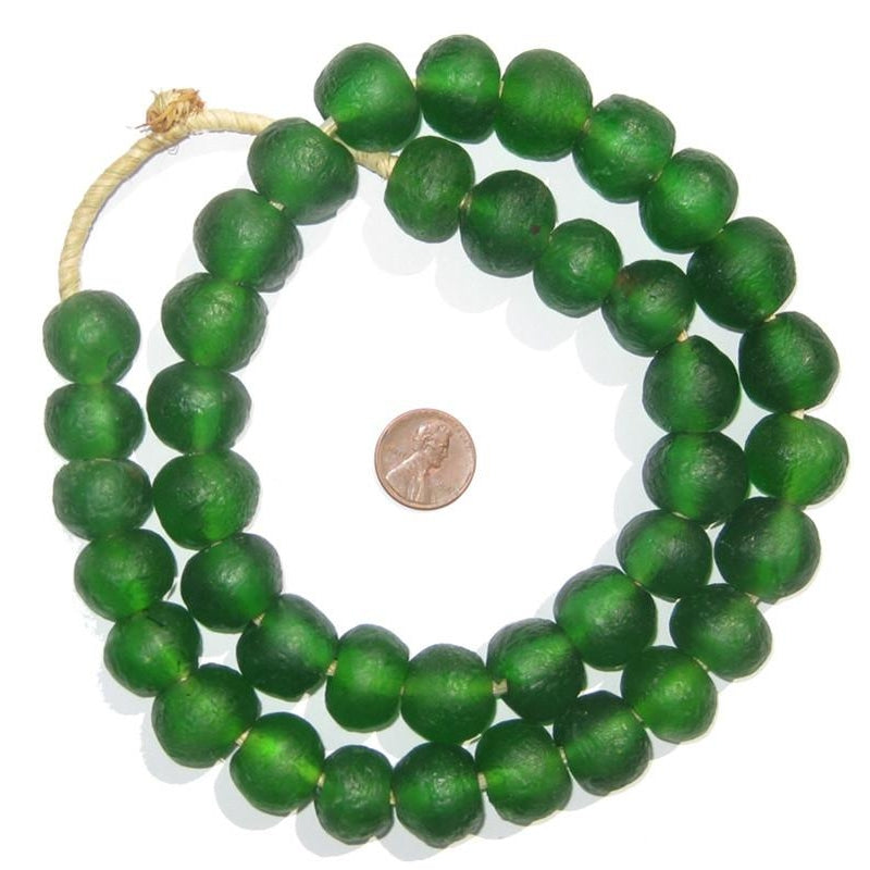 Green Recycled Glass Beads 18 mm Assorted Colors strung together with a penny for size comparison, perfect for decor, jewelry, or unique gifts at Knotty and Board.