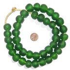Green Recycled Glass Beads 18 mm Assorted Colors strung together with a penny for size comparison, perfect for decor, jewelry, or unique gifts at Knotty and Board.