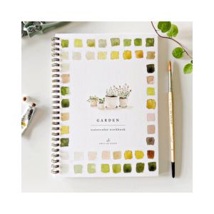 Cover of the Watercolor Workbook, Garden featuring a spiral-bound design with watercolor paint swatches in green and yellow tones, a paintbrush, and a plant nearby, reflecting Knotty and Board’s curated decor and gifts aesthetic.