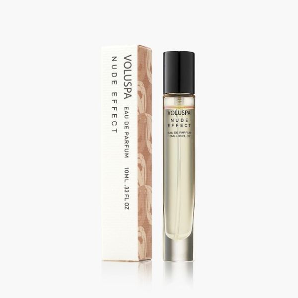 Voluspa, Eau De Parfum, 10 ml, Nude Effect in a clear glass bottle with black cap next to its elegant white and beige packaging, available at Knotty and Board for gifts and decor.