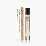 Voluspa, Eau De Parfum, 10 ml, Nude Effect in a clear glass bottle with black cap next to its elegant white and beige packaging, available at Knotty and Board for gifts and decor. 1