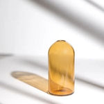 Everlasting Candles Vase Golden Hour made of amber glass catches soft natural light, creating a warm and elegant decor piece perfect for kitchen, dining, or entertaining spaces. 1