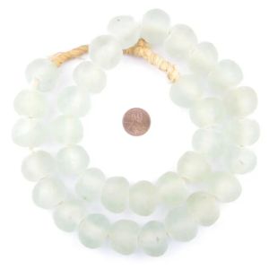 Jumbo Clear Recycled Glass Beads, 24 mm, large translucent beads strung together with a penny for size comparison, perfect for unique decor and gifts from Knotty and Board.