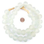 Jumbo Clear Recycled Glass Beads, 24 mm, large translucent beads strung together with a penny for size comparison, perfect for unique decor and gifts from Knotty and Board. 1