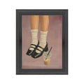 Framed artwork depicting legs wearing white socks and black Mary Janes shoes next to a plastic cup of iced coffee, in a minimalist style for home decor, Caffeine & Mary Janes Art, 7 X 9 in.