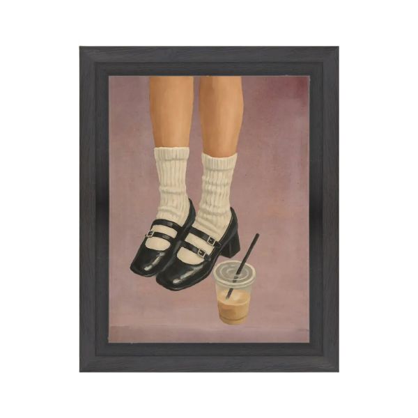 Framed artwork depicting legs wearing white socks and black Mary Janes shoes next to a plastic cup of iced coffee, in a minimalist style for home decor, Caffeine & Mary Janes Art, 7 X 9 in.