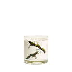 Just Bee Guaiac Wood & Moss, 7 oz. candle in a clear glass container with natural moss and wood design, perfect for home decor or gifts from Knotty and Board. 1