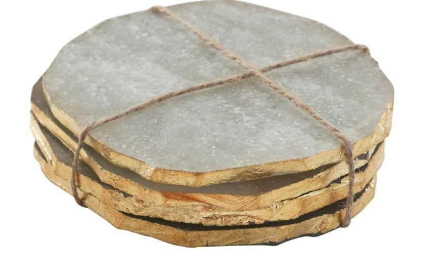 Quartz Coaster Set with Gold Edge featuring round natural quartz coasters with gold trim, tied together with twine, perfect for kitchen and dining decor gifts from Knotty and Board.