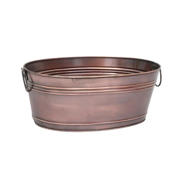 Antique Oval Tub, Copper, 16 X 10 X 6.5 displayed as a rustic decor piece with metal handles, perfect for stylish kitchen or dining gifts from Knotty and Board. Every Room Needs A Little Knotty and Board.