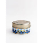 Small tin candle with gold lid and blue checkered label reading Mer-Sea Voyager Tin Candle, ideal for kitchen or dining decor and gifts from Knotty and Board. 1