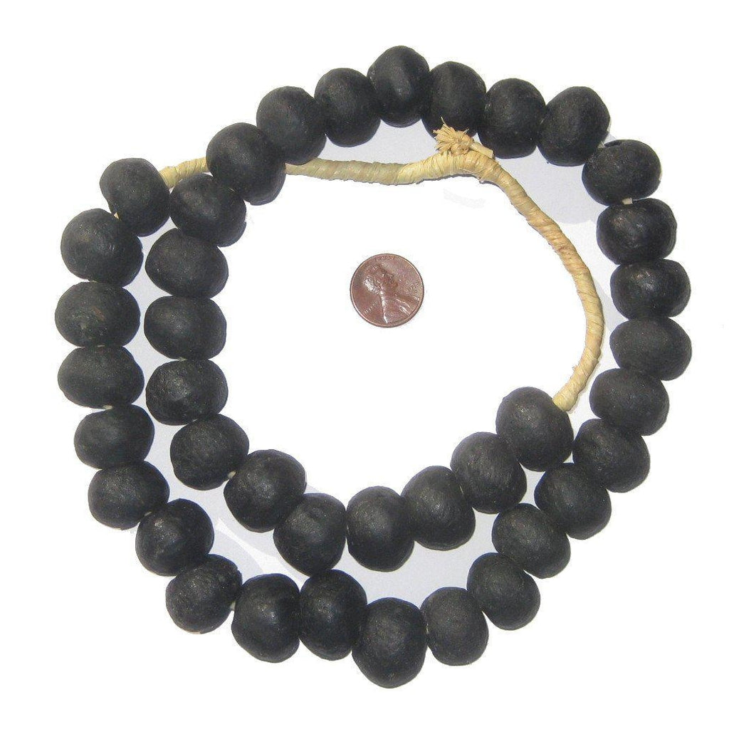 Recycled Glass Beads 18 mm Assorted Colors shown in large round black beads strung on natural twine, displayed with a penny for size comparison, perfect for jewelry and decor projects.