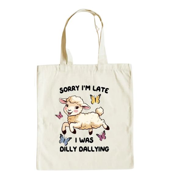 Canvas Tote Bag, Sorry I’m Late featuring a playful lamb surrounded by colorful butterflies and the phrase "Sorry I’m Late I Was Dilly Dallying," ideal for decor and gifts.