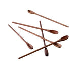 A collection of slender, smooth wooden spoons arranged scattered, showcasing the Wooden Ice Tea Spoon, Priced Individually, perfect for kitchen and dining decor from Knotty and Board. 1