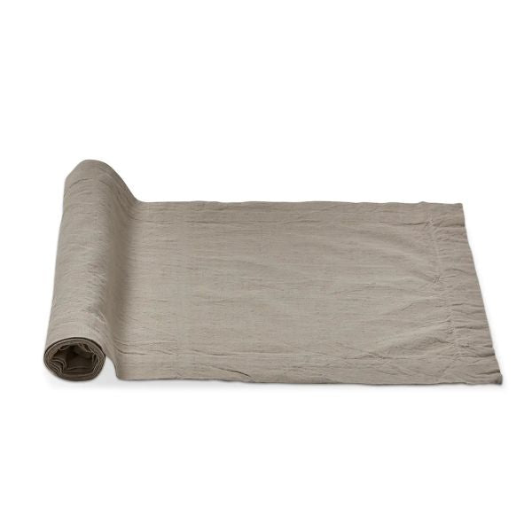 Rolled partially unrolled Slub Cotton Everyday Table Runner, 72 in., Sand in soft neutral tone, perfect for dining or kitchen decor to enhance entertaining spaces from Knotty and Board.