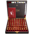 Luxury wooden display case open to reveal multiple small glass vials with golden caps and a booklet, showcasing the Wine Aroma Kit 80-Fragrance Training Kit For Wine Sommelier, a perfect gift from Knotty and Board for wine enthusiasts and decor lovers.