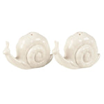 Pair of white ceramic Snails Salt and Pepper Shakers with a glossy finish, perfect for adding whimsical charm to kitchen decor or entertaining by Knotty and Board. 1