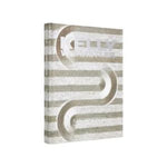 Kelly Wearstler Synchronicity coffee table book with a textured striped cover and modern abstract design, perfect for stylish home decor and gifting from Knotty and Board. 1