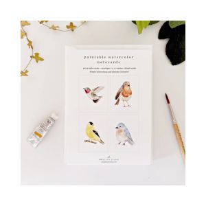Set of Paintable Notecards, Backyard Birds featuring delicate bird watercolor outlines with paintbrush and watercolor tube arranged for creative decorating and gift giving.