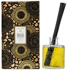 Voluspa Baltic Amber Reed Diffuser, 3.4 fl oz with textured glass bottle and black floral decorative packaging, an elegant home decor gift from Knotty and Board.