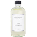 Clear glass bottle of Archipelago Luna Diffuser Oil Refill, 7.8 oz with black cap, simple white label, ideal for home decor and gifts from Knotty and Board. 1