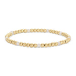 A delicate Stretch Bead & Pearl Bracelet, 4mm, Gold, Priced individually, featuring polished gold beads with white pearls, perfect as a stylish gift from Knotty and Board. 2