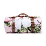 Flannel Fleece Throw Blanket in Leather Holder, Jasmine Joy with soft floral pattern and brown leather straps, a stylish and cozy decor item from Knotty and Board for any room or gift. 1