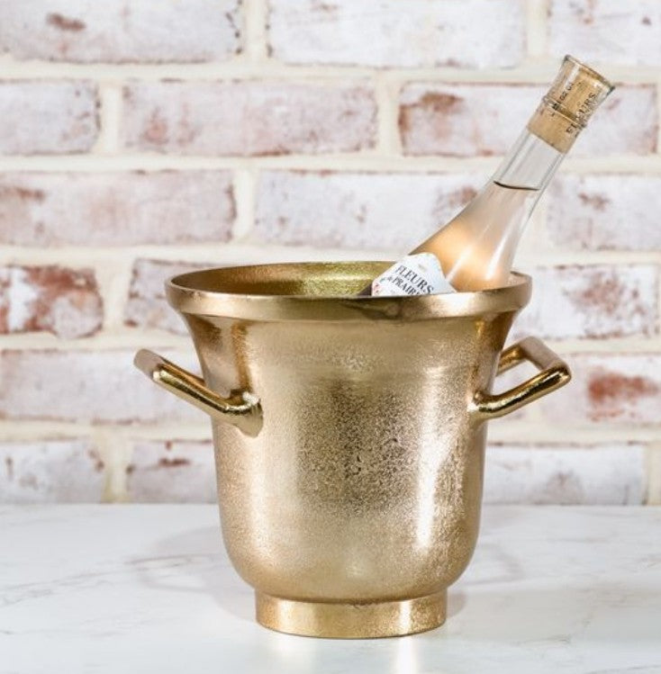 Elegant Gold Ice Bucket 7.5" with a textured gold finish holding a chilled bottle, perfect for entertaining and adding stylish decor from Knotty and Board.