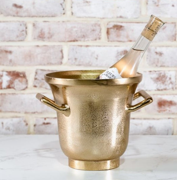 Elegant Gold Ice Bucket 7.5" with a textured gold finish holding a chilled bottle, perfect for entertaining and adding stylish decor from Knotty and Board.